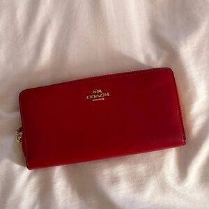 Red leather accordion zip wallet
